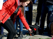 Baku residents bringing flowers to Seaside Boulevard to honor missing oil workers.  Azerbaijan, Dec.07, 2015